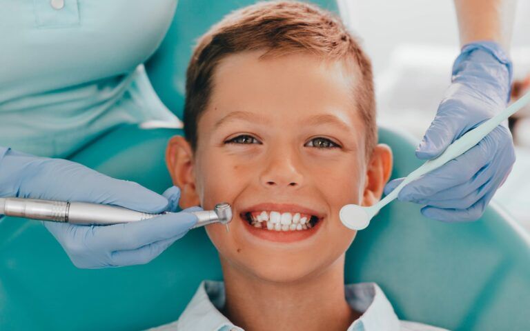 Boy Smiling at Dentist