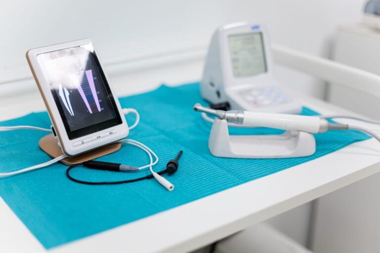 Photo of an apical locator on a dentist's table. Electronic instruments used in endodontics